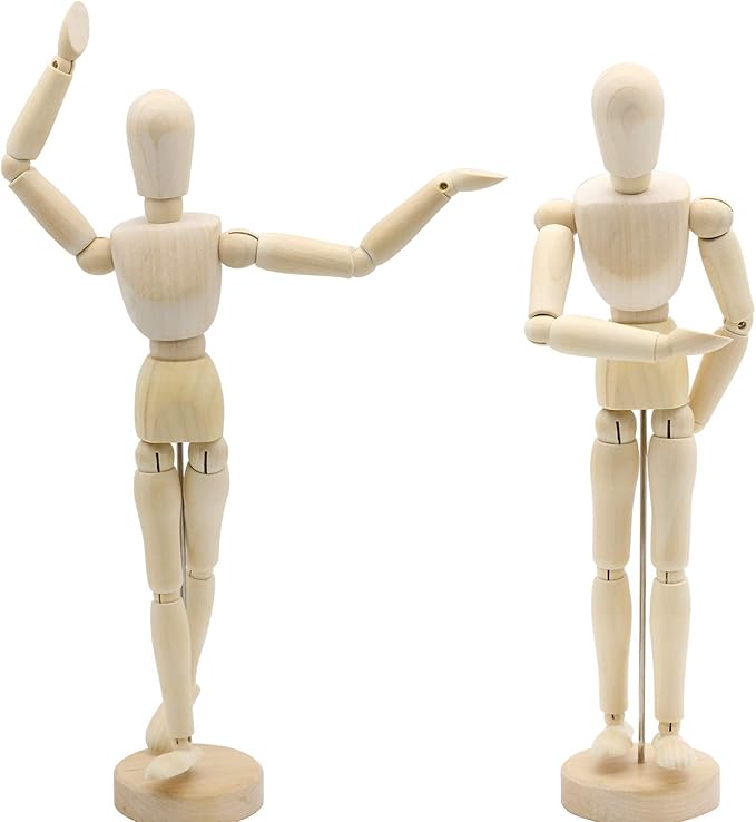 Two wooden mannequin figures in dynamic poses, one raising an arm and the other with an arm crossed, both on wooden bases.