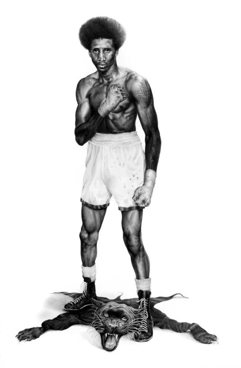A muscular boxer in white shorts and black boots, standing confidently with his left fist raised. He has an afro hairstyle and is depicted in black and white, with his feet on a defeated tiger, showcasing strength and victory.