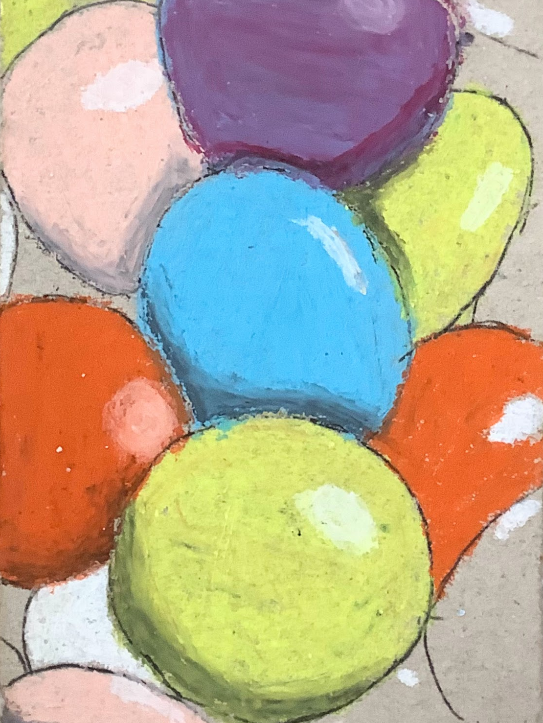 Close-up of colorful oil pastel sweets in various shades including blue, yellow, orange, pink, and purple.